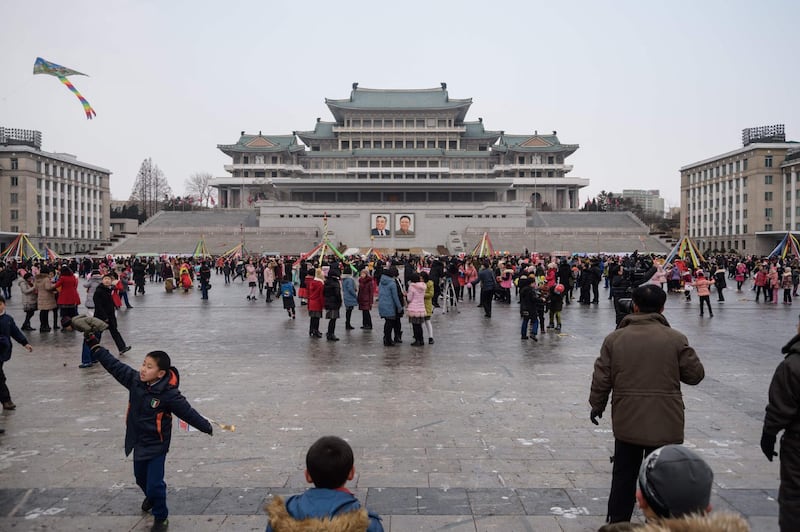 Children play games on Kim Il Sung square in Pyongyang, North Korea. AFP