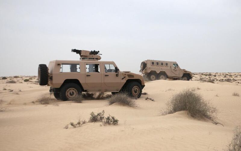 Tawazun military vehicles being put through their paces in a desert exercise last year.  Delores Johnson / The National