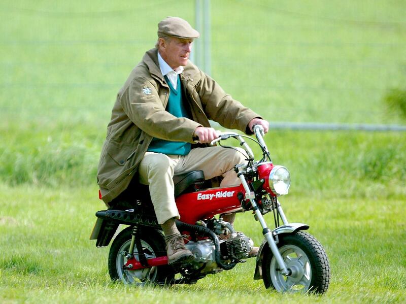 WINDSOR, ENGLAND - MAY 13:  HRH The Duke of Edinburgh rides on his mini motorbike during the Royal Windsor Horse Show at Home Park, Windsor Castle on May 13, 2005 in Windsor, England.  (Photo by Julian Finney/Getty Images)