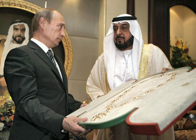 Sheikh Khalifa bin Zayed Al Nahayan (R) presents the country's highest award, the Zayed Order, to Russian President Vladimir Putin (L) at the Mushrif Palace in Abu Dhabi. Putin is accompanied on the trip by the director of arms exporter Rosoboronexport, as well as those of the airline Aeroflot and space agency Roskosmos.        RIA NOVOSTI / KREMLIN POOL / DMITRY ASTAKHOV / AFP PHOTO / POOL / DMITRY ASTAKHOV