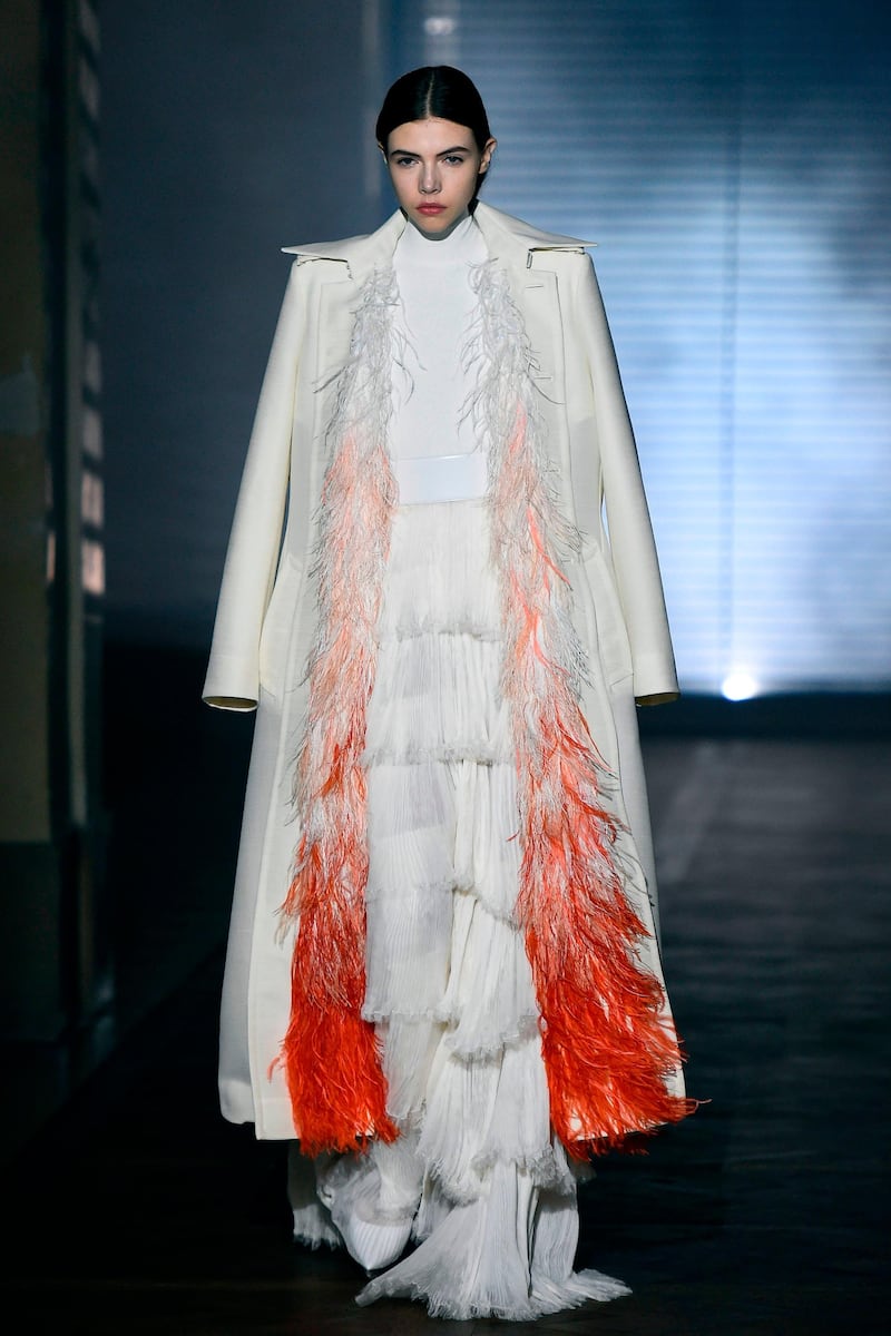 A model presents a creation for Givenchy during the 2018 spring/summer Haute Couture collection fashion show on January 23, 2018 in Paris. / AFP PHOTO / Bertrand GUAY