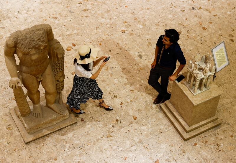 Visitors tour Iraq's National museum in Baghdad. It has reopened to the public after a three-year closure due to the spread of Covid-19 and local unrest. 