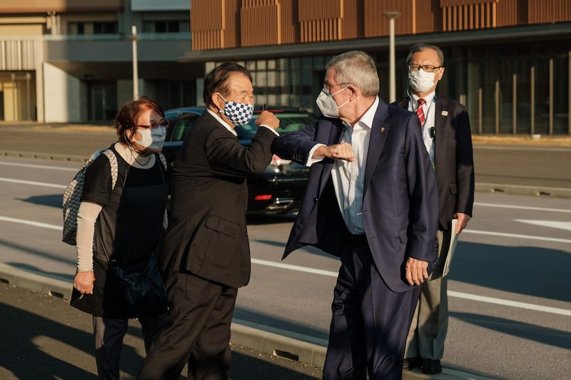 International Olympic Committee president Thomas Bach greets Endo Toshiaki, vice president of Tokyo 2020, during a visit to the Olympic and Paralympic villages in Tokyo. AFP