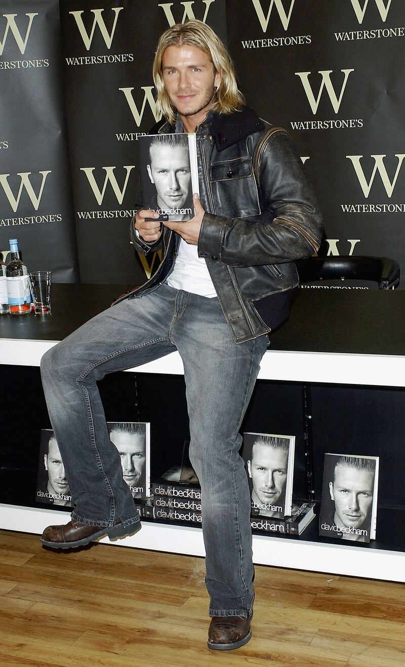 LONDON - NOVEMBER 17:  Footballer David Beckham holds his autobiography "My Side" at the Waterstone's Book store in Piccadilly on November 17, 2003 in London. (Photo by Steve Finn/Getty Images)
