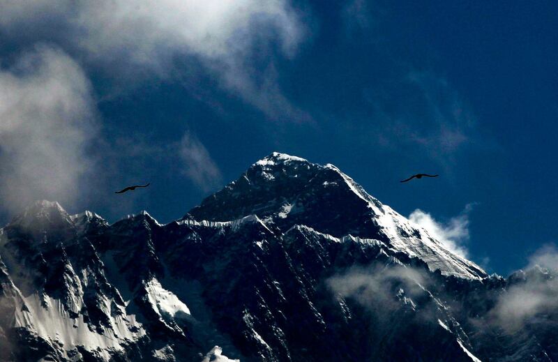 Nepal issued a record 381 Everest permits this season and a short weather window resulted in some teams waiting several hours in the dangerous "dead zone", running out of oxygen supplies and risking exhaustion. AP Photo