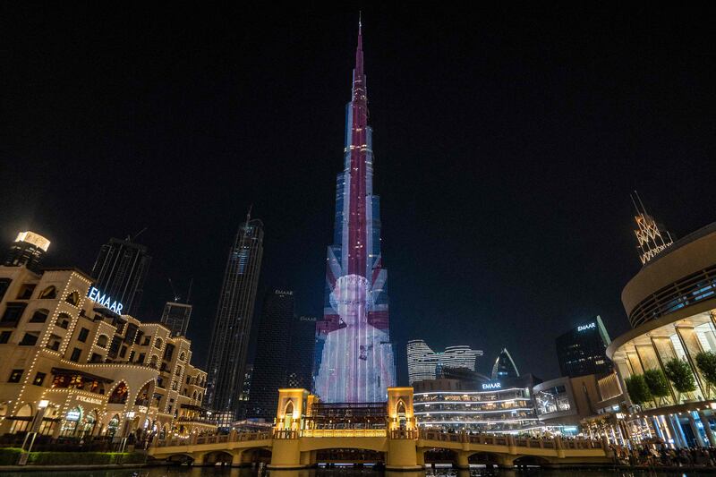 A portrait of Queen Elizabeth II lights up Burj Khalifa following her death in September. AFP