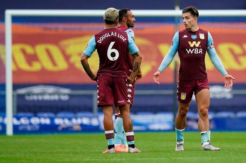 Aston Villa midfielder Jack Grealish, right, reacts after the final whistle at Goodison Park. AFP