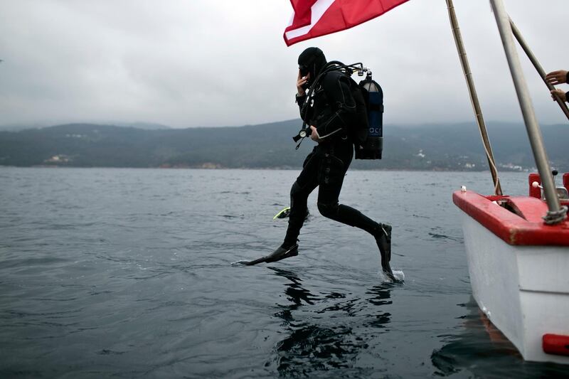 Dimitris Kourkoumelis dives down to an ancient shipwreck, the first ancient shipwreck ear the coast of Peristera, Greece. AP Photo