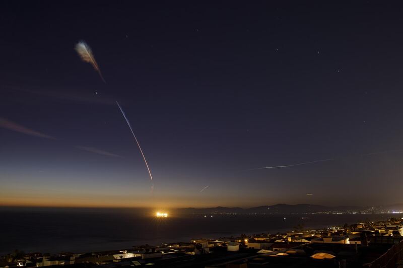 A SpaceX Falcon 9 rocket flies above Manhattan Beach, California. Bloomberg