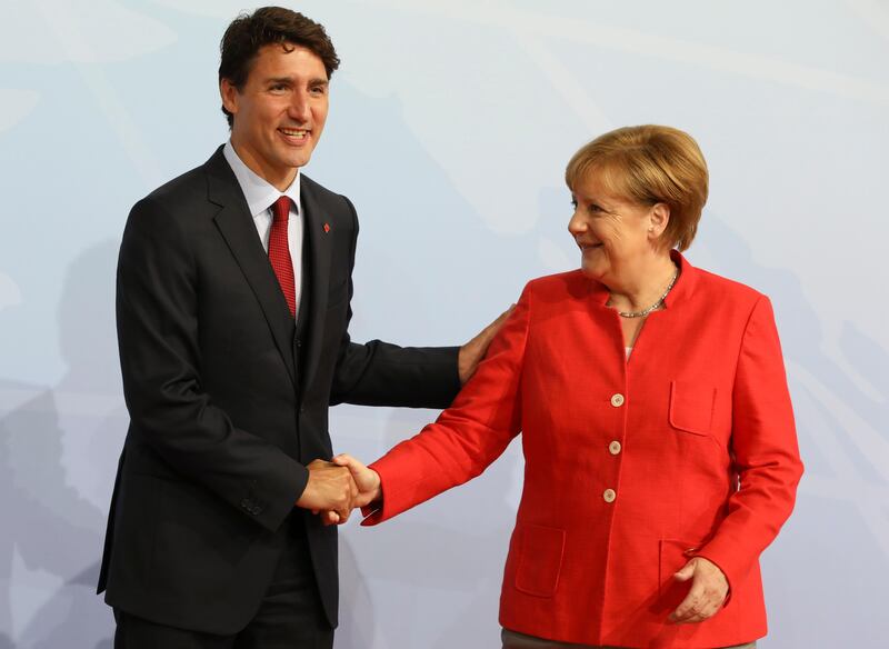 The German chancellor greets Canada's prime minister Justin Trudeau. Ludovic Marin / AFP Photo