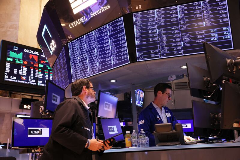 Traders on the floor of the New York Stock Exchange. Investors have been drawn to large companies broadly because of their financial strength and competitive advantages that, in theory, will drive profits even during uncertain economic times. AFP