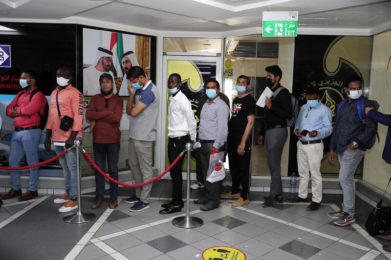 Applicants for jobs as Roads and Transport Authority taxi drivers queue at the Privilege Labour Recruitment Office, in Abu Hail Centre, in Deira, Dubai. Pawan Singh / The National