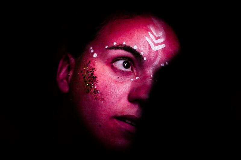 An audience member watching British DJ Fatboy Slim perfom on the third and last day of the Super Bock Super Rock music festival in Lisbon, Portugal.  Mario Cruz.