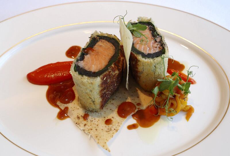 DUBAI, UNITED ARAB EMIRATES , Feb 20  – 2020 :- QG Salmon Wellington dish at the Queen’s Grill restaurant on the QE 2 in Dubai. (Pawan  Singh / The National) For Lifestyle. Story by Janice Rodrigues