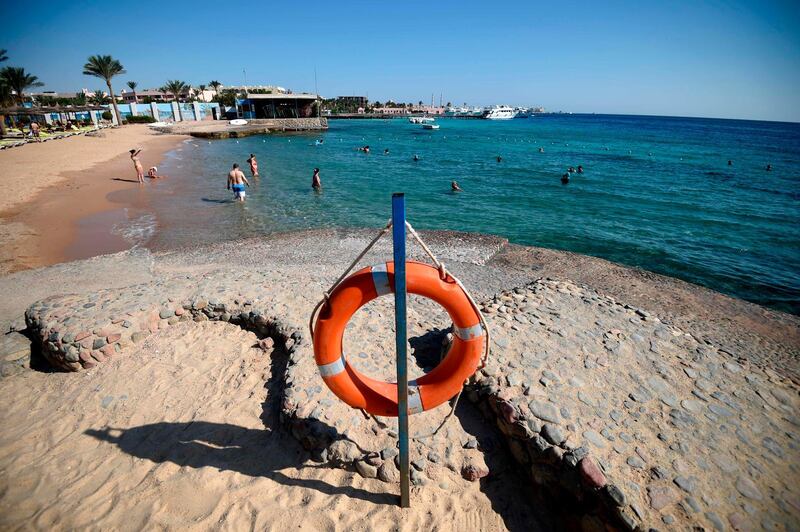 Tourists sunbathe at a beach in Egypt's Red Sea resort town of Hurghada. AFP