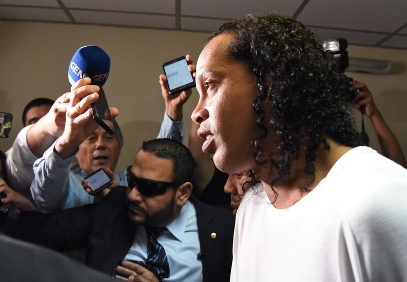 Former Brazil forward Ronaldinho arrives at Asuncion's Justice Palace to testify about his irregular entry to the country, in Asuncion, on March 6, 2020. AFP