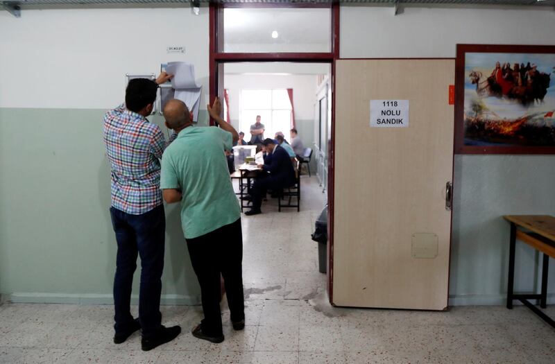 People arrive at a polling station in Yalova, Turkey, on June 24, 2018. Osman Orsal / Reuters