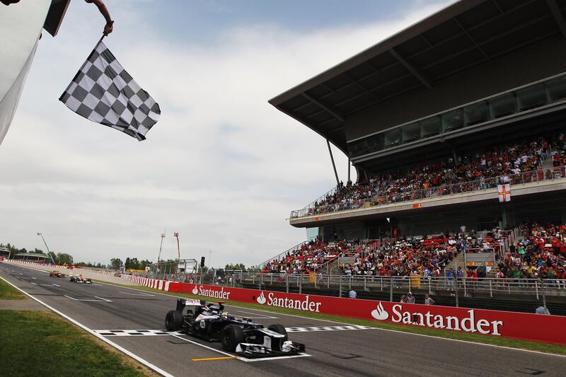 BARCELONA, SPAIN - MAY 13:  Pastor Maldonado of Venezuela and Williams crosses the finishing line to win the Spanish Formula One Grand Prix at the Circuit de Catalunya on May 13, 2012 in Barcelona, Spain.  (Photo by Mark Thompson/Getty Images)