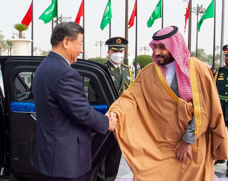 They shook hands in the Royal Court in Riyadh before Prince Mohammed led Mr Xi inside to meet King Salman. AFP