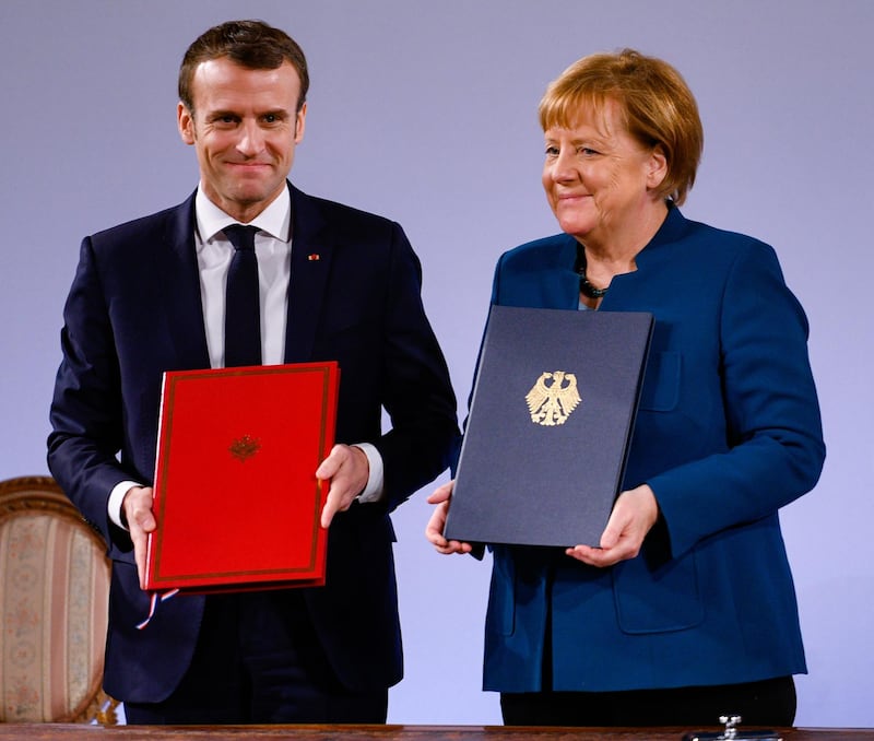 AACHEN, GERMANY - JANUARY 22: German Chancellor Angela Merkel and French President Emmanuel Macron sign the Aachen Treaty on January 22, 2019 in Aachen, Germany. The treaty is meant to deepen cooperation between the countries as a means to also strengthen the European Union. It comes 56 years to the day after then German Chancellor Konrad Adenauer und French President Charles de Gaulle signed the Elysee Treaty, or Joint Declaration of Franco-German Friendship. (Photo by Sascha Schuermann/Getty Images)