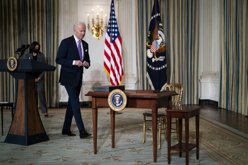U.S. President Joe Biden prepares to sign executive orders in the State Dining Room of the White House in Washington, D.C., U.S., on Tuesday, Jan. 26, 2021. Biden signed a set of executive orders on Tuesday aimed at improving racial equity across American society, including combating discrimination in housing policies and ending the use of private prisons. Photographer: Doug Mills/The New York Times/Bloomberg