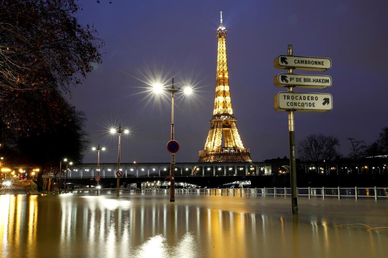 The Eiffel Tower looks down on the flooded banks of the River Seine after days of heavy rain in Paris, the French capital. Reuters