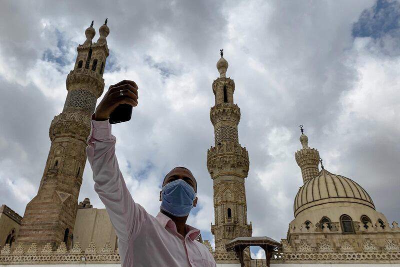 A man wearing a protective face mask takes a selfie photo by his mobile phone after attending the Friday prayers inside Al Azhar mosque. Reuters