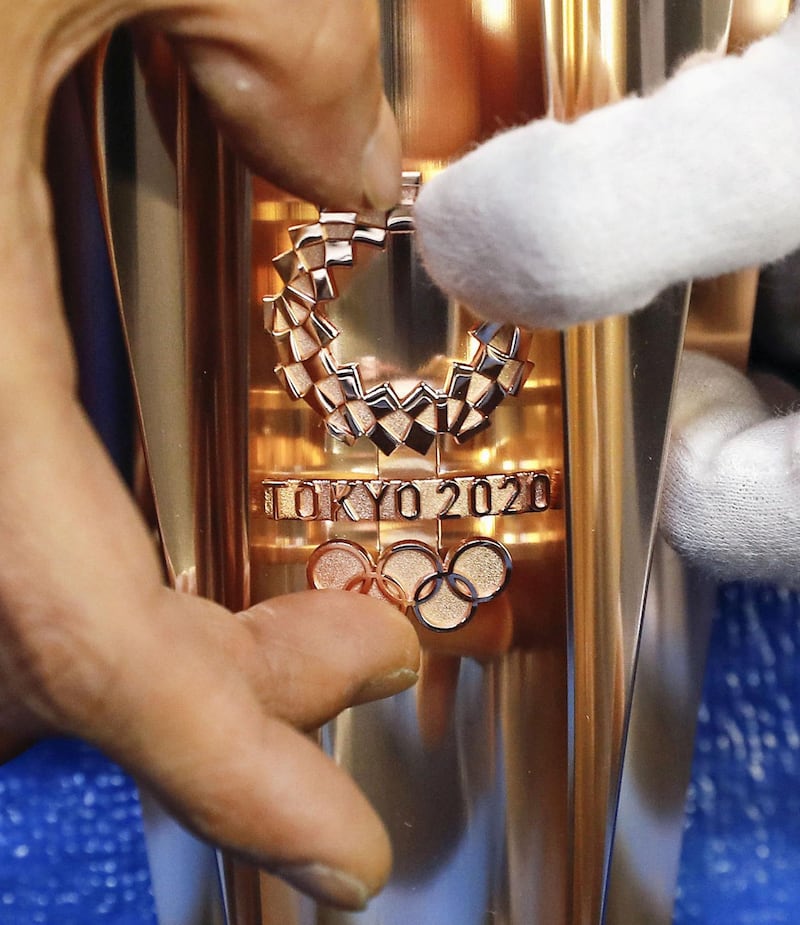 The torch for the 2020 Tokyo Olympics is manufactured at a factory in Tokyo. Kyodo / via Reuters