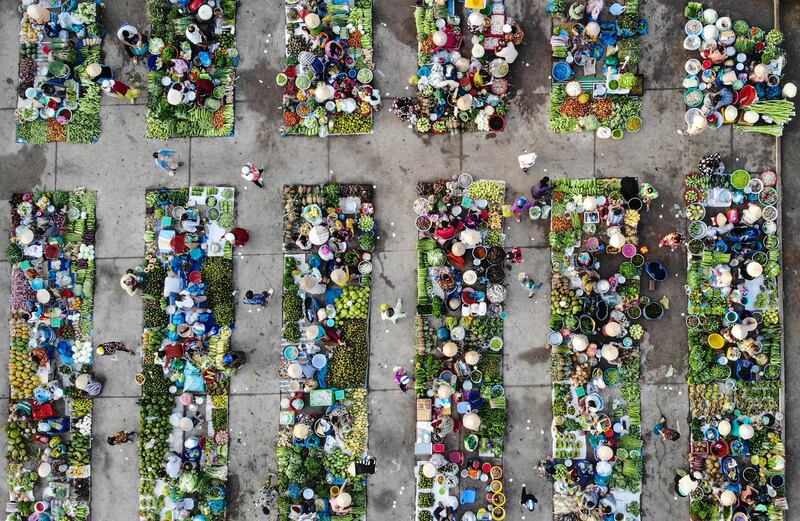 Vendors selling vegetables at Vi Thanh market in Hau Giang province, Vietnam. AFP