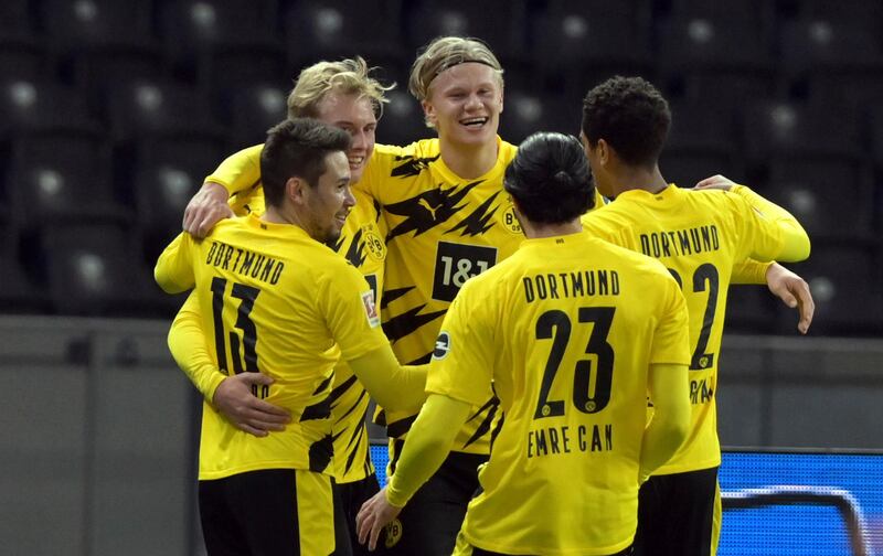 Erling Braut Haaland, centre, after scoring his third goal. AP