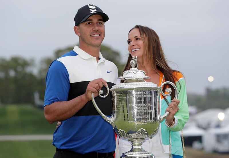 Brooks Koepka, left, poses with the Wanamaker Trophy with his girlfriend Jena Sims. AP Photo