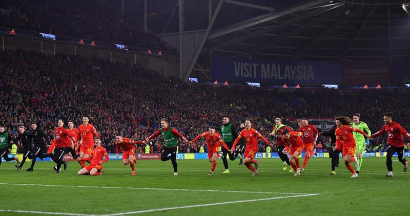 Wales' players celebrate victory and qualification for the Euro 2020 finals. AFP