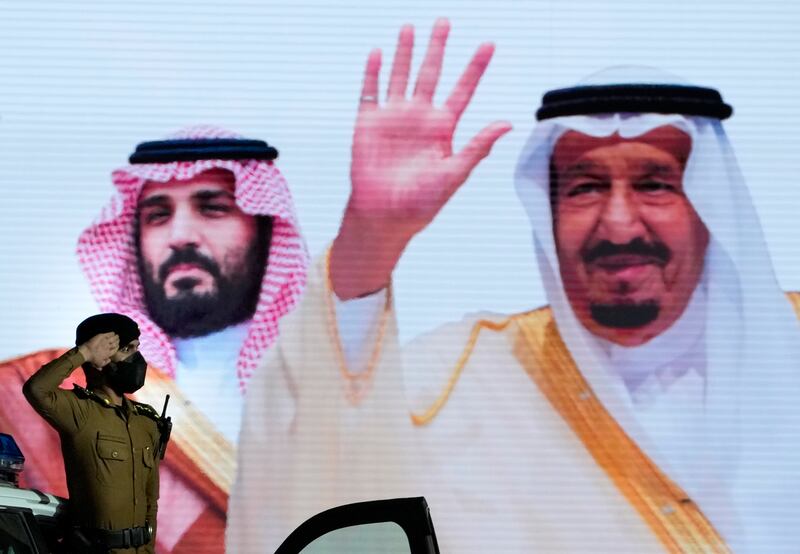 A salute for King Salman and Crown Prince Mohammed bin Salman, depicted on a giant poster. A million Muslims are expected to attend this year's Hajj after two years of pandemic disruption. AP Photo
