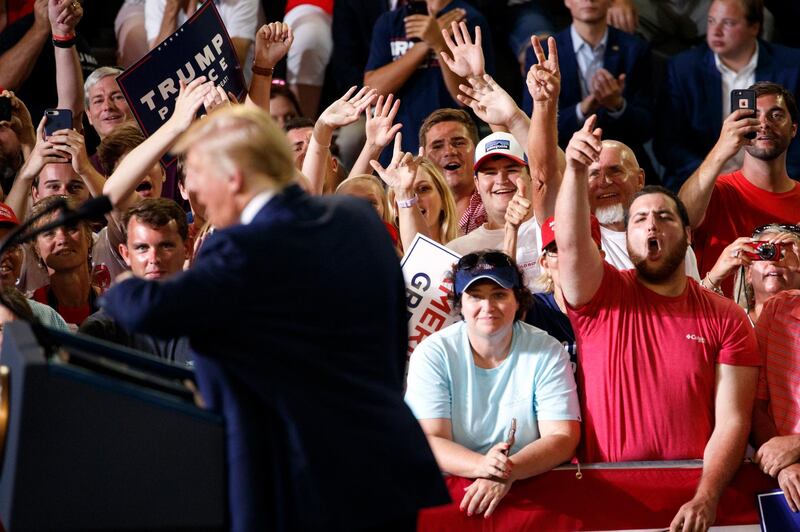 People in the audience cheer as President Donald Trump speaks at a campaign rally at Williams Arena in Greenville, N.C., Wednesday, July 17, 2019. (AP Photo/Carolyn Kaster)