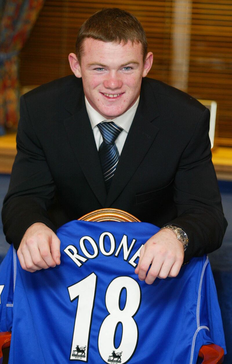 Everton striker Wayne Rooney celebrates after signing a contract with the club on January 17, 2003. PA