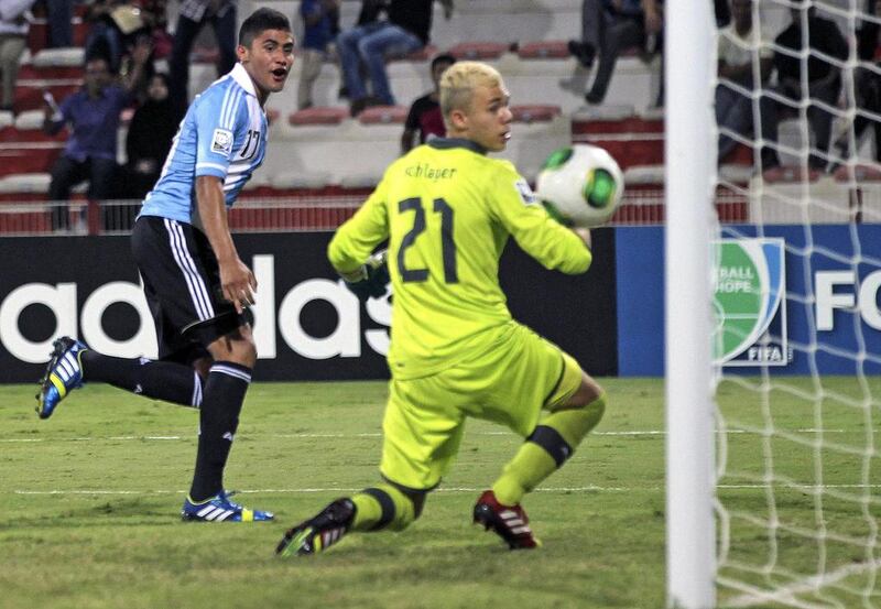 Joaquin Ibanez, left, scored one of Argentina's three goals of the game. Ali Haider / EPA
