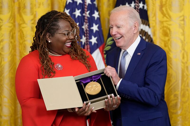 Mr Biden presents the 2021 National Medal of the Arts to Blondel Pinnock on behalf of the Billie Holiday Theatre. AP