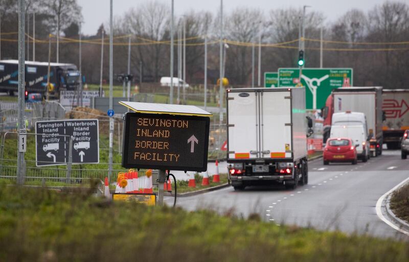 Trucks on the approach road to the Sevington Inland Border facility for customs clearance near Mersham, U.K., on Wednesday, Jan. 20, 2021. A key U.K. government customs system has been overwhelmed within weeks of Brexit and threatens to trigger more disruption as freight traffic rebounds. Photographer: Chris Ratcliffe/Bloomberg