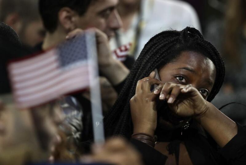 A woman weeps as election results are reported during Democratic presidential nominee Hillary Clinton's election night rally in New York. Frank Franklin II / AP Photo