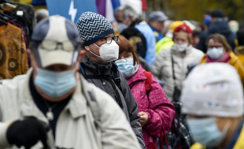 Citizens wear face masks at the Hakaniemi Sunday market in Helsinki, Finland, on Sunday Nov. 1, 2020. People continue their lives with Sunday markets although face masks have become more popular to protect against the coronavirus. (Markku Ulander/Lehtikuva via AP)