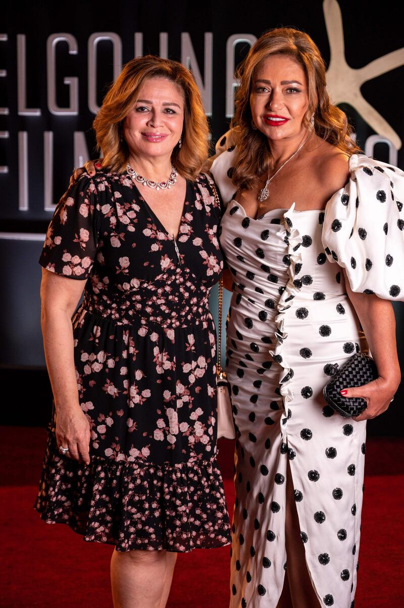 Egyptian actresses Ilham Shahin and Laila Elwi arrive for the screening of '200 Metres' on day three of the fourth El Gouna Film Festival. AFP