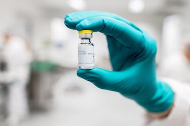 File photo: A lab worker holds a vial of Johnson & Johnson's Janssen Covid-19 vaccine candidate in an undated photograph. Johnson & Johnson via Reuters.