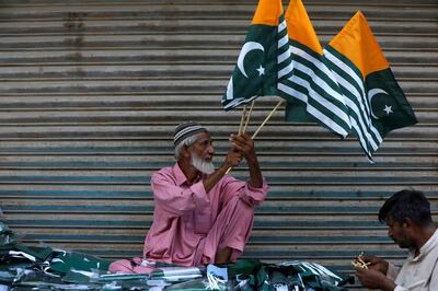 A man sells Kashmir's flags and patriotic memorabilia ahead of Pakistan's Independence Day, along a market in Karachi, Pakistan August 13, 2019. REUTERS/Akhtar Soomro