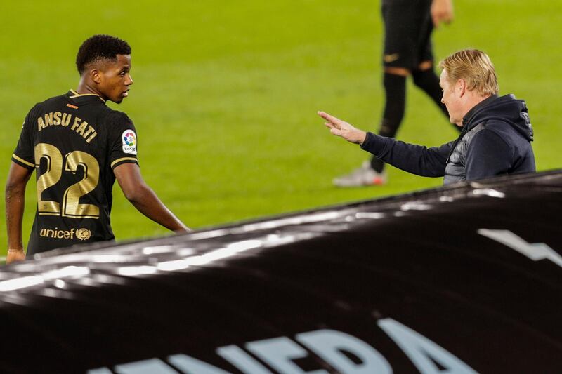 Koeman talks to Barcelona teenager Ansu Fati. AP