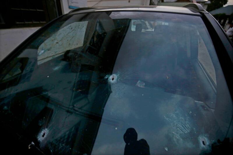 epa06807657 A view of bullet holes in the windshield of the vehicle in which Shujaat Bukhari, senior journalist and Editor-in-Chief of English daily 'Rising Kashmir,' was killed in a militant attack at Press Colony in Srinagar, the summer capital of Indian Kashmir, 14 June 2018. Bukhari and his personal security officer (PSO) were shot dead by unknown attackers outside his office in Srinagar on 14 June evening.  EPA/FAROOQ KHAN