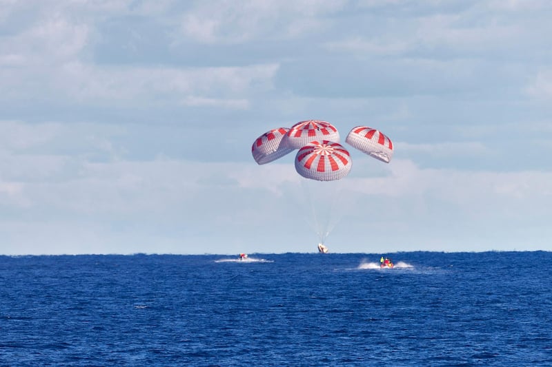 The SpaceX capsule splashes down, in the Gulf of Mexico.  AP