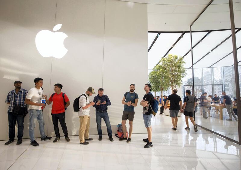 <p>Apple fans join a line to get the new iPhone XS at the Apple store in Dubai Mall. Leslie Pableo / The National</p>
