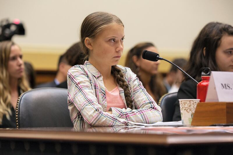 Swedish environment activist Greta Thunberg looks on during a joint hearing before the House Foreign Affairs Committee, Europe, Eurasia, Energy and the Environment Subcommittee, and the House Select Committee on the Climate Crisis, at the Rayburn House Office Building on Capitol Hill in Washington, DC, on September 18, 2019. (Photo by Alastair Pike / AFP)