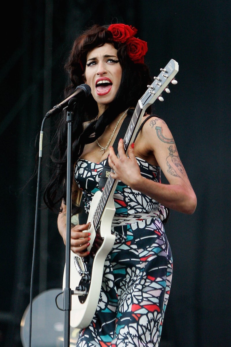 CHELMSFORD, UNITED KINGDOM - FILE:  Amy Winehouse performs live on the V stage during Day Two of V Festival 2008 at Hylands Park on August 17, 2008 in Chelmsford, England. Winehouse has been found dead in her flat in North London on July 23, 2011.   (Photo by Simone Joyner/Getty Images) *** Local Caption ***  504652016.jpg