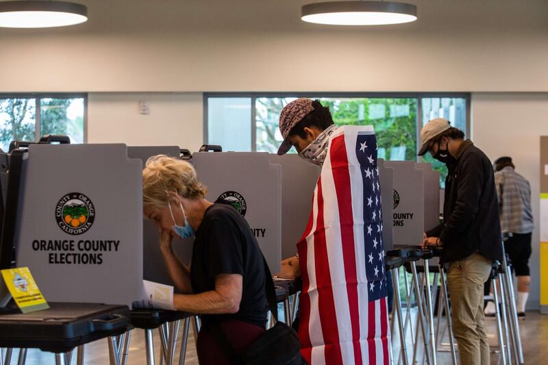 NEWPORT BEACH , CA - NOVEMBER 03: David Boston Angel (c) marks his ballot at Marina Park Community Vote Center on November 3, 2020 in Newport Beach, California. After a record-breaking early voting turnout, Americans head to the polls on the last day to cast their vote for incumbent U.S. President Donald Trump or Democratic nominee Joe Biden in the 2020 presidential election.   Apu Gomes/Getty Images/AFP
== FOR NEWSPAPERS, INTERNET, TELCOS & TELEVISION USE ONLY ==
